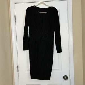 Long sleeved pin-stiped bodycon dress.